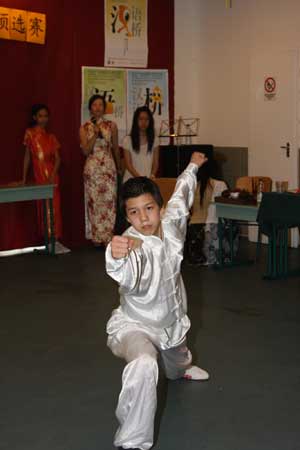 Liu Anguo, who won the competition ultimately, performs Chinese Kungfu during the preliminary Budapest round of this year's 'Chinese Bridge', a Chinese-language proficiency competition for foreign high school students, in Budapest, capital of Hungary, May 22, 2009. Liu Anguo and two runner-ups will attend the semi-finals in central China's Chongqing Municipality in October this year.