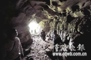 Villagers inspect damaged stalactites in the Qibaoshan Karst Cave in Dazu County, Chongqing. 