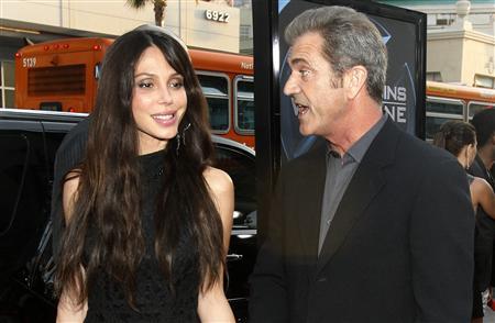 Mel Gibson and actress Oksana Grigorieva arrive at an industry screening of 'X-Men Origins: Wolverine' at the Grauman's Chinese theatre in Hollywood, California April 28, 2009. 