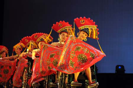 Some hearing-impaired and handicapped artists rehearse on the stage in the Art Performance Center in Liuzhou City of southwest China's Guangxi Zhuang Autonomous Region, on the early morning of May 25, 2009. Dozens of physically disabled artists had a rehearsal against time in the Art Performance Center for the coming 7th Guangxi Joint Performing Art Festival for the Disabled. 