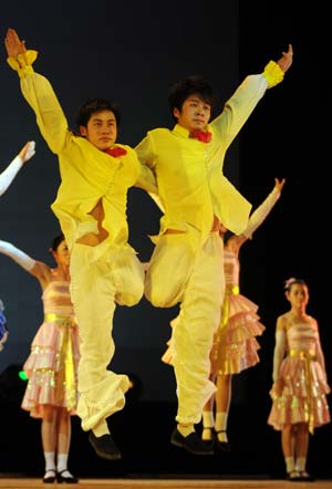 Some handicapped artists rehearse on the stage in the Art Performance Center in Liuzhou City of southwest China's Guangxi Zhuang Autonomous Region, on the early morning of May 25, 2009. Dozens of physically disabled artists had a rehearsal against time in the Art Performance Center for the coming 7th Guangxi Joint Performing Art Festival for the Disabled. 