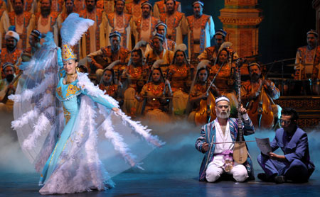 Actors perform the Uyghur Muqam in Urumqi, capital of northwest China's Xinjiang Uygur Autonomous Region, May 27, 2009. Xinjiang Uyghur Muqam is a mixture of song, dance, folk performing art and classical music.(Xinhua/Zhao Ge)