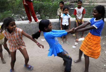 Children play at a slum in New Delhi, India, on May 29, 2009. The Oscar-winning film 