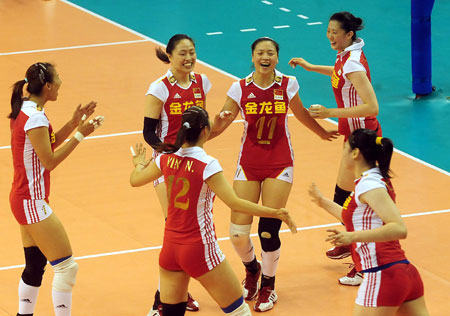 Chinese team members jubilate after winning over Cuba during a match at the 2009 Chinese Women's Volleyball Tournament in Luohe, a city of central China's Henan Province, May 31, 2009. China won 3-0, and got the champion of the tournament with all victories. (Xinhua/Wang Song)