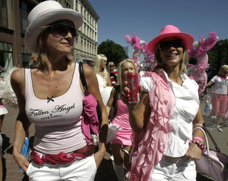 Revellers walk during the 