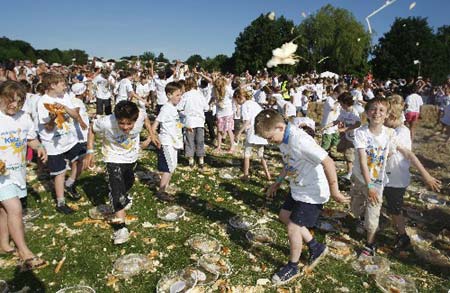 251 children take part in an attempt at the largest custard pie fight at the Kidz Stuff Festival in Horsham, in southern England May 31, 2009. The current record is 120 and the new record is waiting for verification by the Guiness Book of Records.