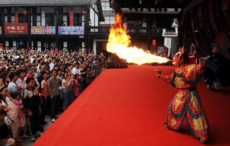 A Sichuan Opera player performs on stage during the 2nd International Festival of the Intangible Cultural Heritage in Chengdu, southwest China's Sichuan province on June 1, 2009. The 13-day festival has attracted representatives from more than 40 countries and regions. [Xinhua]