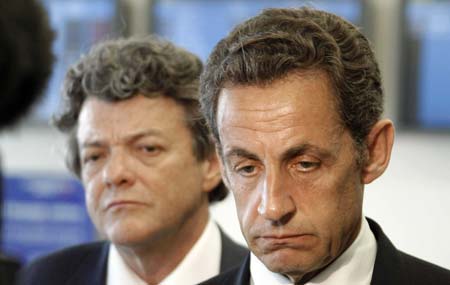 France's President Nicolas Sarkozy (R) and transport minister Jean-Louis Borloo speak at the crisis center at Charles de Gaulle airport near Paris June 1, 2009. An Air France plane with 228 people on board was presumed to have crashed into the Atlantic Ocean on Monday after hitting heavy turbulence during a flight from Rio de Janeiro to Paris. 