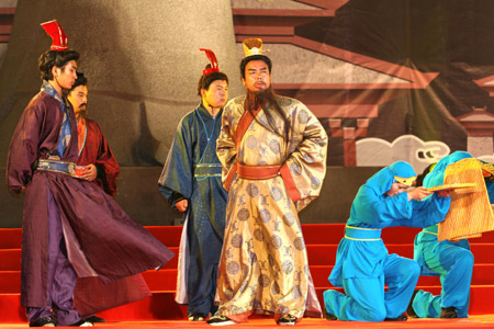 Performers reenact the scenario of the story related to the famous figures in the three kingdom period, during the 3rd Three Kingdoms Cultural Week, in the Xudu Capital Park, in Xuchang City, central China's Henan Province, June 1, 2009. (Xinhua/Niu Shupei) 