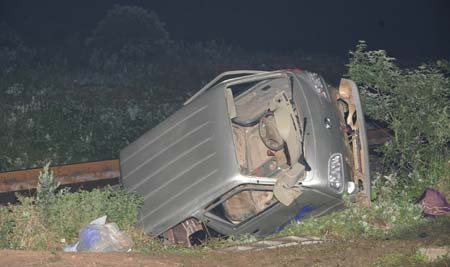 The debris of the minitruck lies on the roadside after a crash with a train near Tianmen, central China's Hubei Province, June 2, 2009. A minitruck crashed with the train K8086 here on Tuesday leaving 9 dead and 9 wounded. (Xinhua/Cheng Min) 