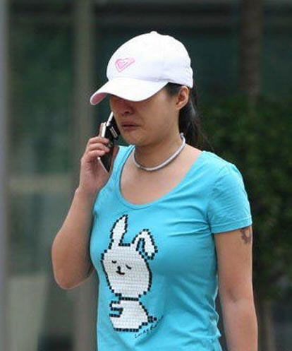 Actress Hao Lei was spotted crying over her cell phone on a Beijing street on June 1, 2009. 