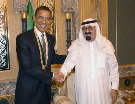 U.S. President Barack Obama (L) shakes hands with Saudi King Abdullah bin Abdulaziz after being presented King Abdul Aziz Order of Merit in Riyadh, capital of Saudi Arabia, June 3, 2009. Obama held a summit with Saudi king Abdullah bin Abdulaziz shortly after his arrival in Saudi Arabia on Wednesday, the first leg of his Middle East tour.