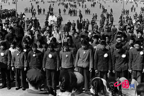 Young people standing in silent tribute at the Monument to the People's Heroes, March 31, 1976