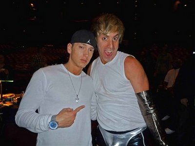 In this image released by RapRadar.com, Eminem, left, and Sacha Baron Cohen, dressed as the character Bruno, pose together on Saturday, May 30, 2009, the day before the MTV Music Awards in California.