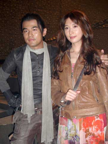 Taiwan pop star Jay Chow and supermodel Lin Chi-ling pose for photos on the set of adventure film 'Ci Ling' on June 3, 2009. 'Ci Ling' tells a story of time and space shuttle, without detailing the exact time slots and places for the whole story.