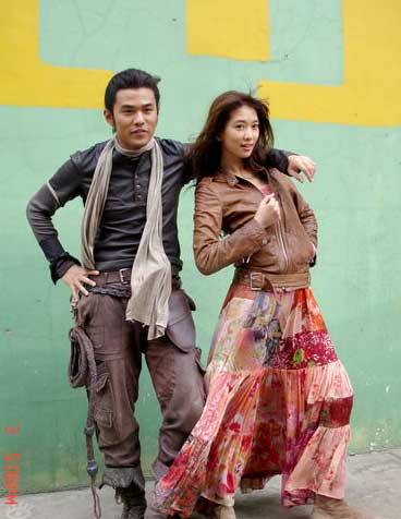 Taiwan pop star Jay Chow and supermodel Lin Chi-ling pose for photos on the set of adventure film 'Ci Ling' on June 3, 2009. 'Ci Ling' tells a story of time and space shuttle, without detailing the exact time slots and places for the whole story.
