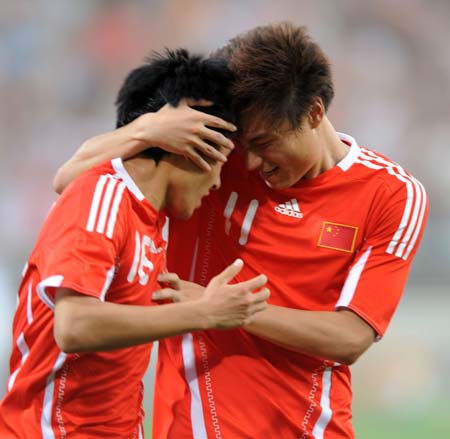 China's Jiang Ning (L) celebrates his goal with teammate Gao Lin during Team China International Football Friendly Match against Saudi Arabia in Tianjin, north China, June 4, 2009. 