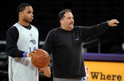 Orlando Magic guard Jameer Nelson, left, listens as coach Stan Van Gundy runs drills during practice for the NBA basketball finals in Los Angeles, Wednesday, June 3, 2009. The Los Angeles Lakers face the Magic in Game 1 on Thursday. [Chris Carlson/AP Photo] 