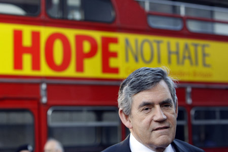 Britain's Prime Minister Gordon Brown talks to the media in front of the 'Hope not Hate' campaign bus in central London June 1, 2009. The 'Hope not Hate' campaign will tour the country to remind the public of Britain's core values, prior to the local and European elections on Thursday, June 4, 2009. (Xinhua/Reuters File Photo)