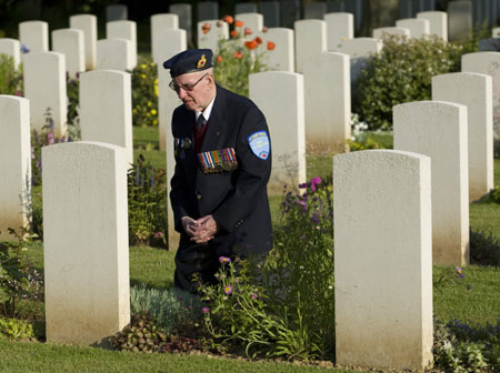 Canadian veteran of the Normandy D-Day invasion Windsor Macdonald, 84, of Moncton, N.B., visits for the first time the grave of his brother 65 years after he was killed, at the Canadian war cemetery in Beny-sur-Mer June 5, 2009. Windsor&apos;s brother Alwyn Macdonald, a private with the of the North Shore (New Brunswick) Regiment, was killed July 22, 1944 at the age of 29.