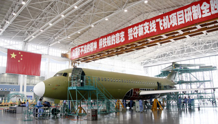An ARJ21 (Advanced Regional Jet for the 21st Century) plane is assembled at Shanghai Aircraft Manufacturing Co., Ltd in Shanghai, east China, June 6, 2009. The Final Assembly Center of the Commercial Aircraft Corporation of China, Ltd (COMAC), based on the Shanghai Aircraft Manufacturing Co., Ltd, was formally inaugurated on Saturday. (Xinhua/Pei Xin)