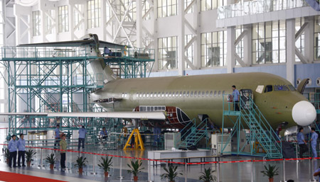 An ARJ21 (Advanced Regional Jet for the 21st Century) plane is assembled at Shanghai Aircraft Manufacturing Co., Ltd in Shanghai, east China, June 6, 2009. (Xinhua/Pei Xin)