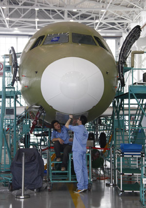 An ARJ21 (Advanced Regional Jet for the 21st Century) plane is assembled at Shanghai Aircraft Manufacturing Co., Ltd in Shanghai, east China, June 6, 2009. (Xinhua/Pei Xin)