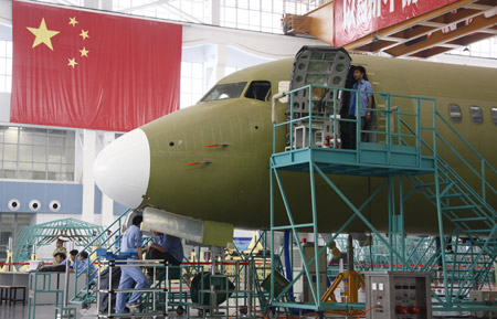 An ARJ21 (Advanced Regional Jet for the 21st Century) plane is assembled at Shanghai Aircraft Manufacturing Co., Ltd in Shanghai, east China, June 6, 2009. (Xinhua/Pei Xin)