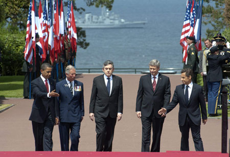 (L to R) U.S. President Barack Obama, Britain's Prince Charles, British Prime Minister Gordon Brown, Canadian Prime Minister Stephen Harper and France's President Nicolas Sarkozy arrive at the Colleville-sur-Mer cemetery to attend a ceremony marking the 65th anniversary of the D-Day landings in Normandy, June 6, 2009. [Xinhua/Reuters]