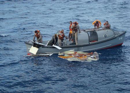 A total of 15 bodies were found Sunday in the Atlantic Ocean near the site where an Air France jetliner was believed to have crashed a week ago, bringing the number of bodies retrieved to 17, Brazilian military officials said. A handout picture from the Brazilian Air Force shows Brazilian Navy sailors picking a piece of debris from Air France Airbus A330 out of the Atlantic Ocean, some 745 miles (1,200 km) northeast of Recife.[Xinhua/Brazilian Air Force/Handout]