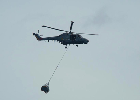 A handout picture from the Brazilian Air Force shows a Brazilian Navy helicopter recovering debris of the crashed Air France Airbus A330 at the Atlantic Ocean, some 745 miles (1,200 km) northeast of Recife. [Xinhua/Brazilian Air Force/Handout]