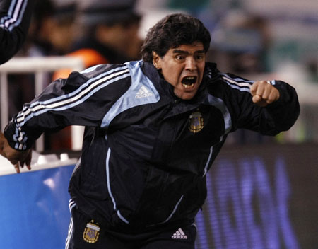 Argentina's head coach Diego Maradona celebrates after a goal against Colombia in their 2010 World Cup qualifying soccer match in Buenos Aires June 6, 2009.(Xinhua/Reuters Photo) 