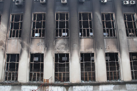 The picture taken on June 8, 2009 shows the ruins of a fire which engulfed the science and technology hall of the Bengbu Science Palace in Bengbu city in east China's Anhui province. An employee on duty were killed in the early morning fire and the cause is under investigation.(Xinhua Photo)