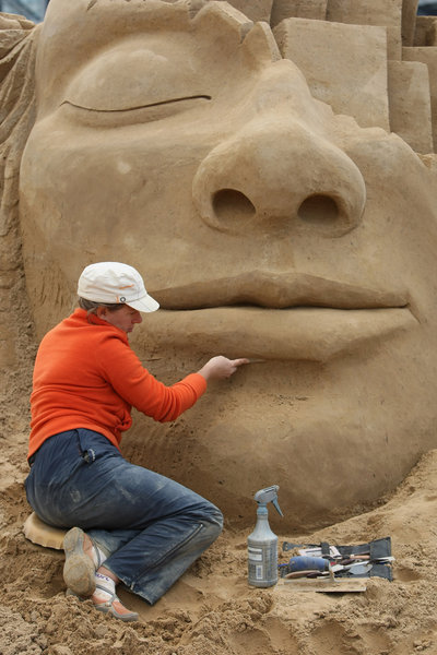 Artist Natasha Kamenskaia of Australia works on her sand sculpture titled 'The Dream' at the 7th Sandsation international sand sculpture festival on June 8, 2009 in Berlin, Germany. Sandsation runs through August 30 and has attracted artists from all over the world. [CFP] 