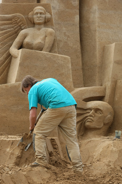 Artist Martin Tulinius of Denmark works on his sand sculpture whose theme is the future of the city of Berlin at the 7th Sandsation international sand sculpture festival on June 8, 2009 in Berlin, Germany. Sandsation runs through August 30 and has attracted artists from all over the world. [CFP]