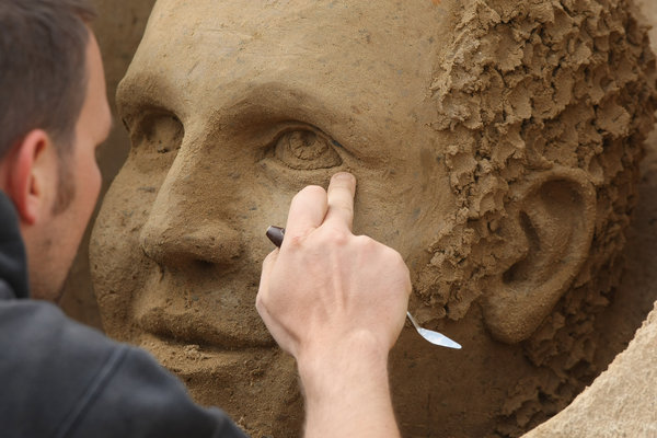 Artist Gianni Schiumarini of Italy works on his sand sculpture at the 7th Sandsation international sand sculpture festival on June 8, 2009 in Berlin, Germany. Sandsation runs through August 30 and has attracted artists from all over the world. [CFP]