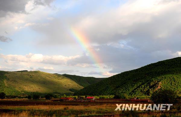 A colorful rainbow stretches over the sky of a small village in Aershan city, Inner Mongolia Autonomous Region. Aershan city lies at the foot of the middle reaches of Great Khingan Range and borders the Hulun Buir Grassland to the east. With mineral springs dotting the blue-green Aershan Mountain of the city, the pastoral vistas of Aershan draw large numbers of tourists who come to escape from the hustle and bustle of metropolis life. Photo taken on June 7. [Photo: Xinhuanet] 