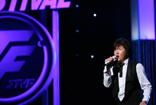 Chinese singer Sun Nan performs during the opening gala of the 15th Shanghai Television Festival at the Shanghai Grand Theater in east China's Shanghai June 8, 2009.