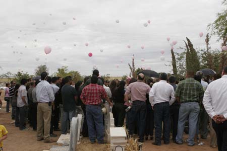 People held a funeral for children who died in a fire in a daycare center in Hermosillo, Sonora state, Mexico, on June 8, 2009. The fire took place in the daycare center here on June 5 have already claimed 43 children's lives.[Xinhua]