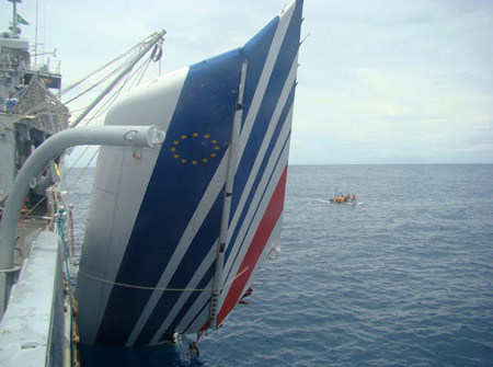 Handout picture released on June 9, 2009 by the Brazilian Navy shows a piece of tailfin of the Air France A330 aircraft that crashed June 1 while in midflight over the Atlantic ocean, being hoisted by a Navy rescue vessel.