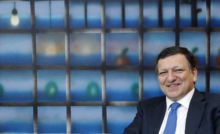 European Commission President Jose Manuel Barroso poses at the EU Commission headquarters in Brussels, June 9, 2009. Barroso declared his candidacy on Tuesday for a second five-year term as president of the European Commission, the European Union's executive arm. [Xinhua/Reuters]