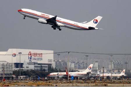 File picture taken on April 8, 2009 shows an aircraft of China Eastern Airlines takes off from the Hongqiao International Airport in Shanghai, China. A spokesman for China Eastern Airlines, a leading carrier in the country, confirmed on June 8, 2009 that it plans to merge with smaller rival Shanghai Airlines.[Xinhua]