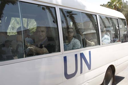 Members of EU Parliament delegation are seen on a bus in southern Gaza Strip, in June 9, 2009. A delegation of 41 European legislators entered the Gaza Strip via Egypt to inspect the war-torn territory on Tuesday. More than 1,400 Palestinians were killed in the Israeli assault on Gaza between Dec. 27, 2008 and Jan. 18, 2009, most of them civilians, say human rights groups. [Xinhua]