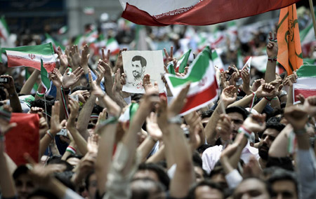 Supporters of Iranian President Mahmoud Ahmadinejad attend his last presidential campaign in Tehran, capital of Iran, on June, 10, 2009, prior to the upcoming 10th presidential election slated for Friday. [Zhang Ning/Xinhua]