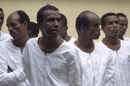 Some suspected Somali pirates are seen in Mombasa, city of east Kenya, June 10, 2009. U.S. Navy handed over 17 suspected Somali pirates to Kenyan authorities on Wednesday against the backdrop of foreign warships stepping up naval patrols off the coast of Somalia. [Xinhua]