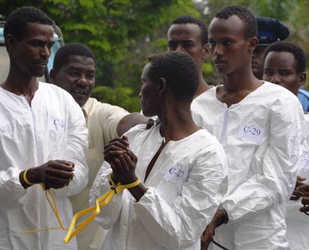 Some suspected Somali pirates are seen in Mombasa, city of east Kenya, June 10, 2009. U.S. Navy handed over 17 suspected Somali pirates to Kenyan authorities on Wednesday against the backdrop of foreign warships stepping up naval patrols off the coast of Somalia. [Xinhua]