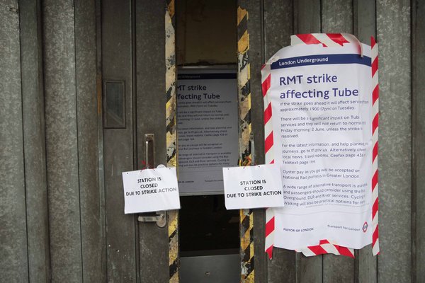 A sign at Mile End underground station saying that the station is closed due to strike action. [CFP]