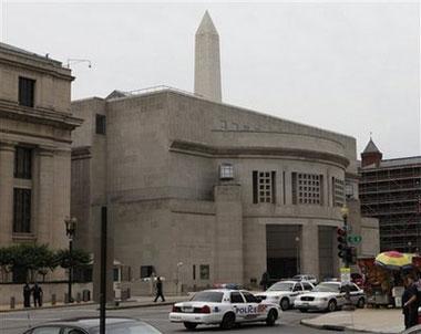 The Washington Monument looms over the U.S. Holocaust Memorial Museum in Washington, Wednesday, June 10, 2009. [Charles Dharapak/AP Photo]