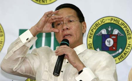 Health Secretary Francisco Duque III gestures during a news conference at the Department of Health (DOH) headquarters in Manila June 11, 2009. Duque said on Thursday, 15 new cases of new flu virus were confirmed bringing the total number of Influenza A(H1N1) cases to 92, the highest number in southeast Asia.[Xinhua/Reuters]