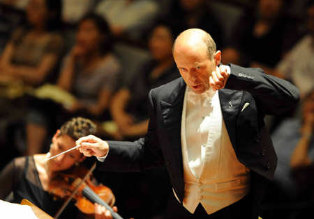  Conductor Ivan Fischer and the United States National Symphony Orchestra perform during a concert at the National Center for the Performing Arts in Beijing, capital of China, on June 11, 2009. [Luo Xiaoguang/Xinhua]